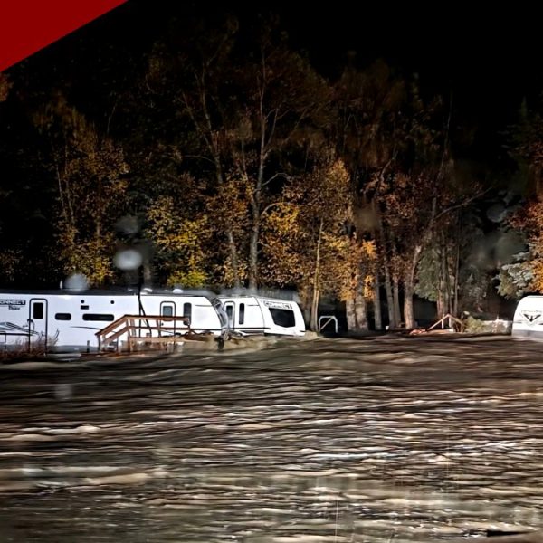 Historic Flooding Strands Families on Rooftops Across San Juan County